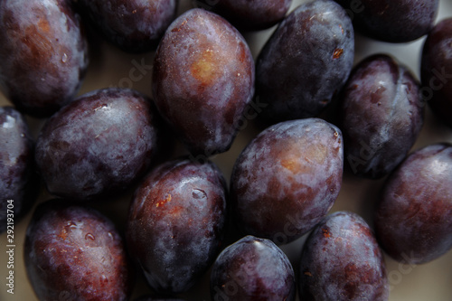 plums in wood plate