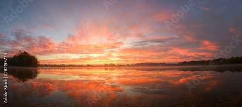 Beautiful Sunrise of Golden Clouds Reflected on a Lagoon