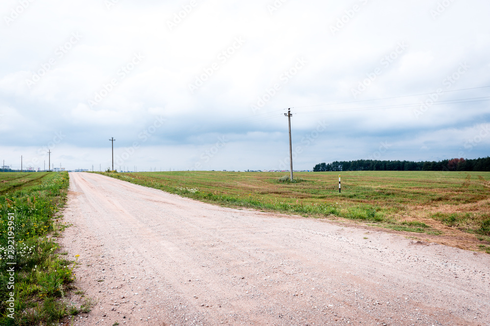 Empty country road surrounded by summer field. Empty country road surrounded by summer field.