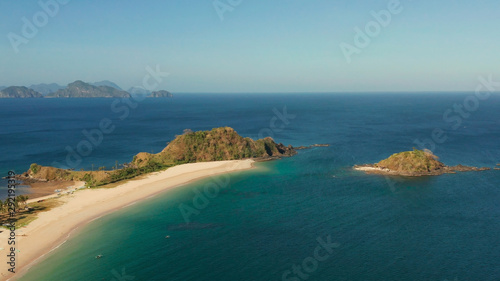 Wide sand beach Nacpan Beach  aerial view. El Nido  Palawan  Philippine Islands. Seascape with tropical beach and islands. Summer and travel vacation concept