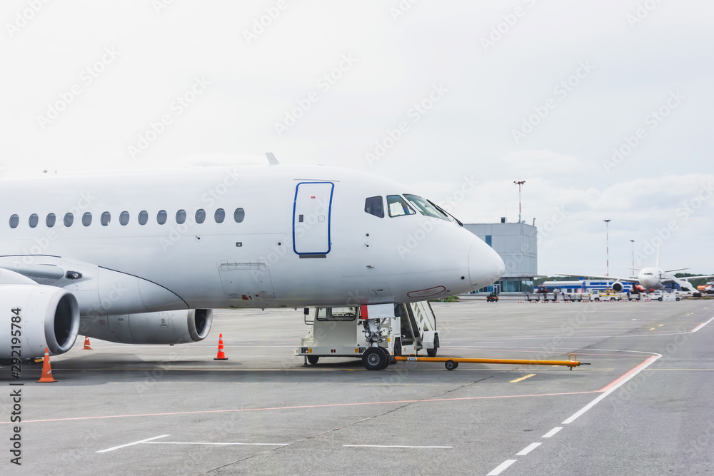 Airplane with a ladder at the airport terminal building. Airplane with a ladder at the airport terminal building.