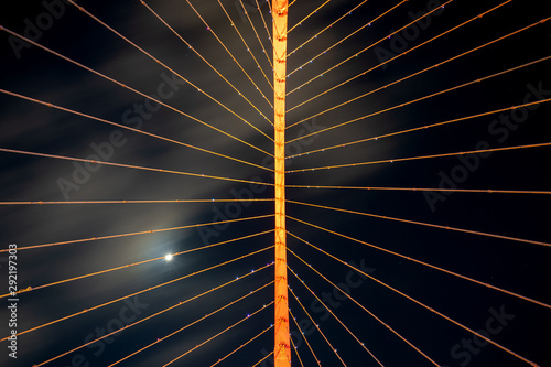 Looking upwards at a suspended bridge