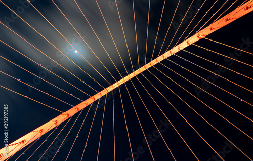 Looking upwards at a suspended bridge