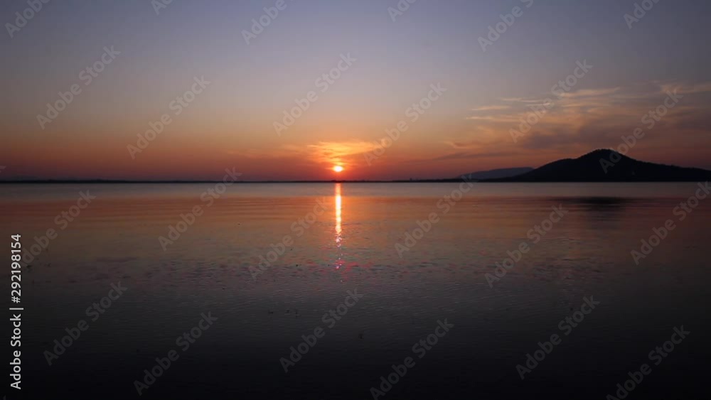 Sunset on the river. Nature river in sunset. Beautiful sunset in the nature in autumn. Autumn sunset in nature