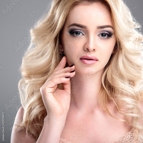 Beauty portrait of blonde beautiful woman with perfect makeup and hair style  isolated. Spa and hair  healthy skin