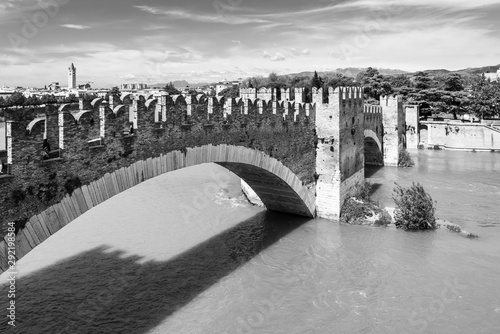 Medieval brigde over river in Verona - black and white photo photo