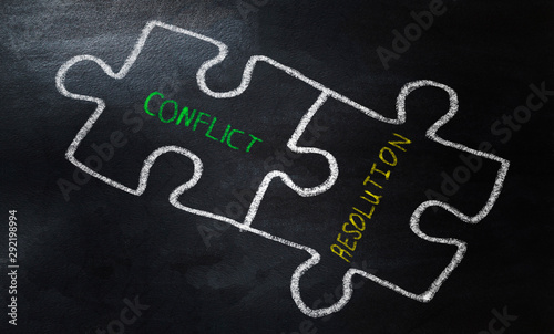 Conflict and resolution words drawing puzzle with chalk