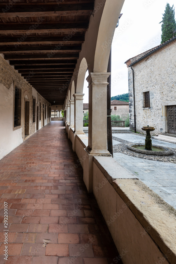 Obraz premium The abbey of Santa Maria in the village of Follina / Trevigiani hills