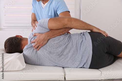 Chiropractic / Osteopathy treatment, Back pain relief. Physiotherapy for male patient, sport injury recovery , Kinesiology
