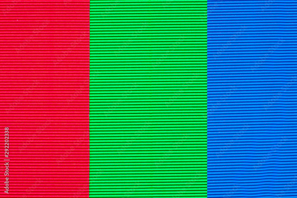 Sheets of colored embossed paper. Laid one on top of the other. Abstractions and backgrounds. Close-up.
