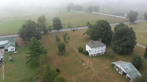 Part 2 of a full aerial orbit to left in fog around the Pearl S. Buck birthplace museum in Hillsboro, West Virginia. photo