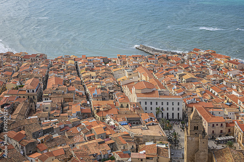 Panorama of Sicilian coastal medieval small city Cefalu (Cephaloedium) with turquoise Tyrrhenian Sea and blue sky. Province of Palermo, Cefalu, Sicily, Italy. photo