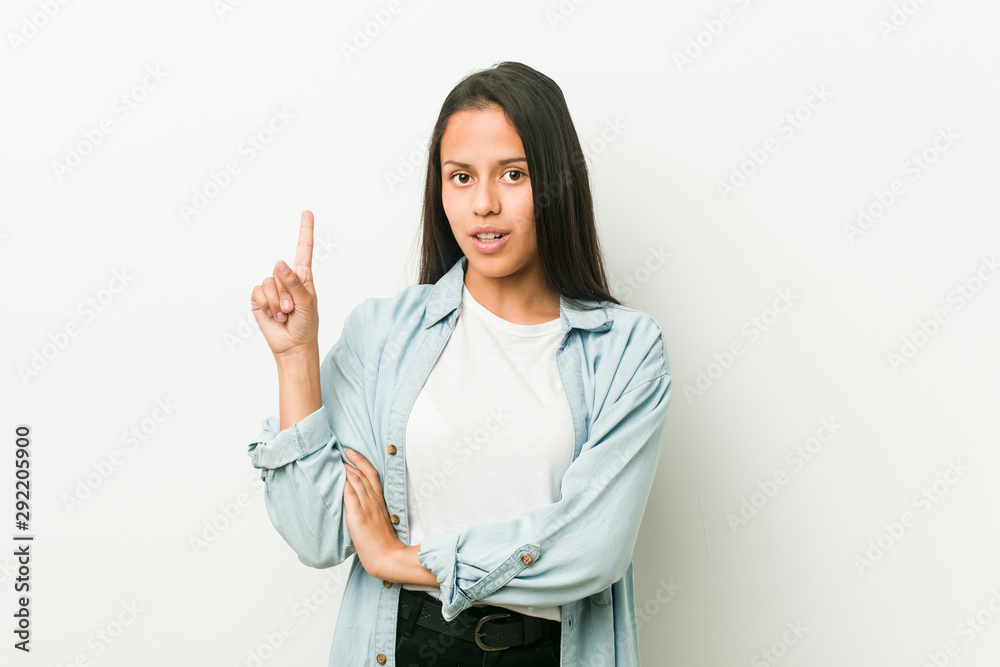 Young hispanic woman having some great idea, concept of creativity. Young hispanic woman having some great idea, concept of creativity.