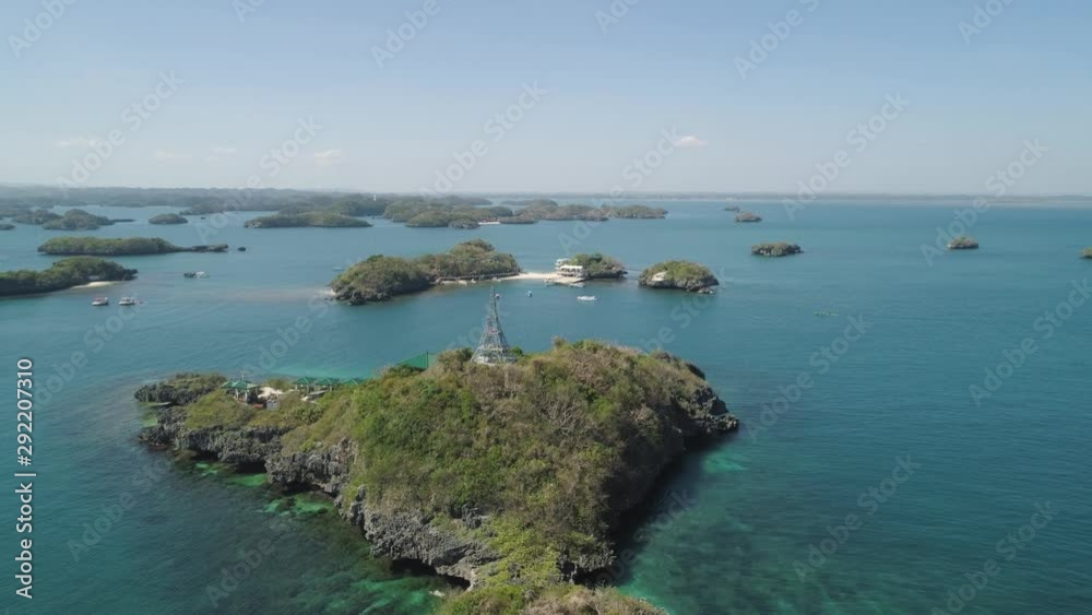 Aerial view of Small islands with beaches and lagoons in Hundred Islands National Park, Pangasinan, Philippines. Famous tourist attraction, Alaminos. Aerial view of Small islands with beaches and lagoons in Hundred Islands National Park, Pangasinan, Philippines. Famous tourist attraction, Alaminos.
