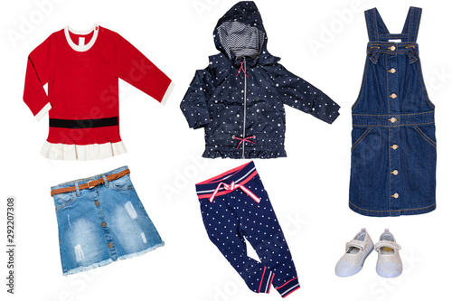 Collage set of little girl clothes isolated on a white background. The collection of a blue rain jacket with pants, jeans skirt, a sleeveless blue jeans dress and a other red sweater or pullover. Autu © Olga