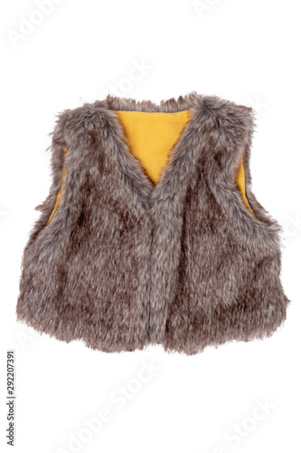 Fur vest. A brown fur vest with yellow wool lining fabric for the little girl isolated on a white background. Child spring and autumn fashion.