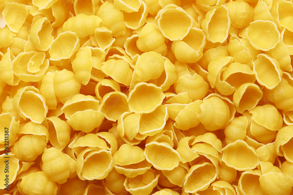 Raw pasta as a background. Top view. Texture, place for text. Raw pasta as a background. Top view. Texture, place for text.