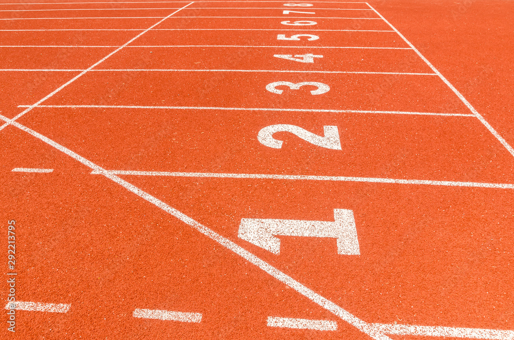 Start or finish position on running line track rubber lanes in the sport stadium.