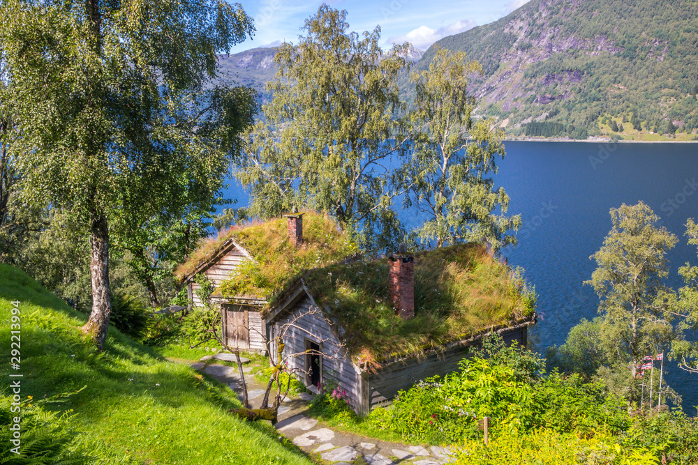 old wooden house on the lake in mountains