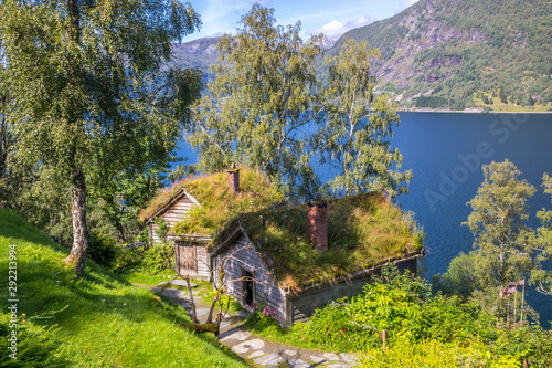 old wooden house on the lake in mountains © tmag