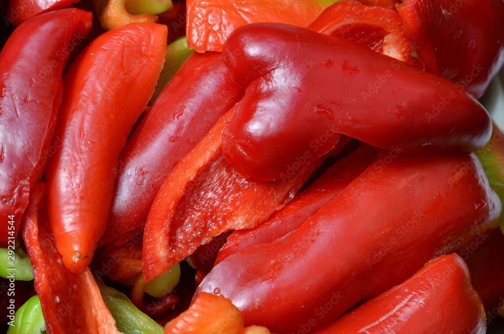 Sliced in the form of slices, sweet pepper as a background. Sliced in the form of slices, sweet pepper as a background.