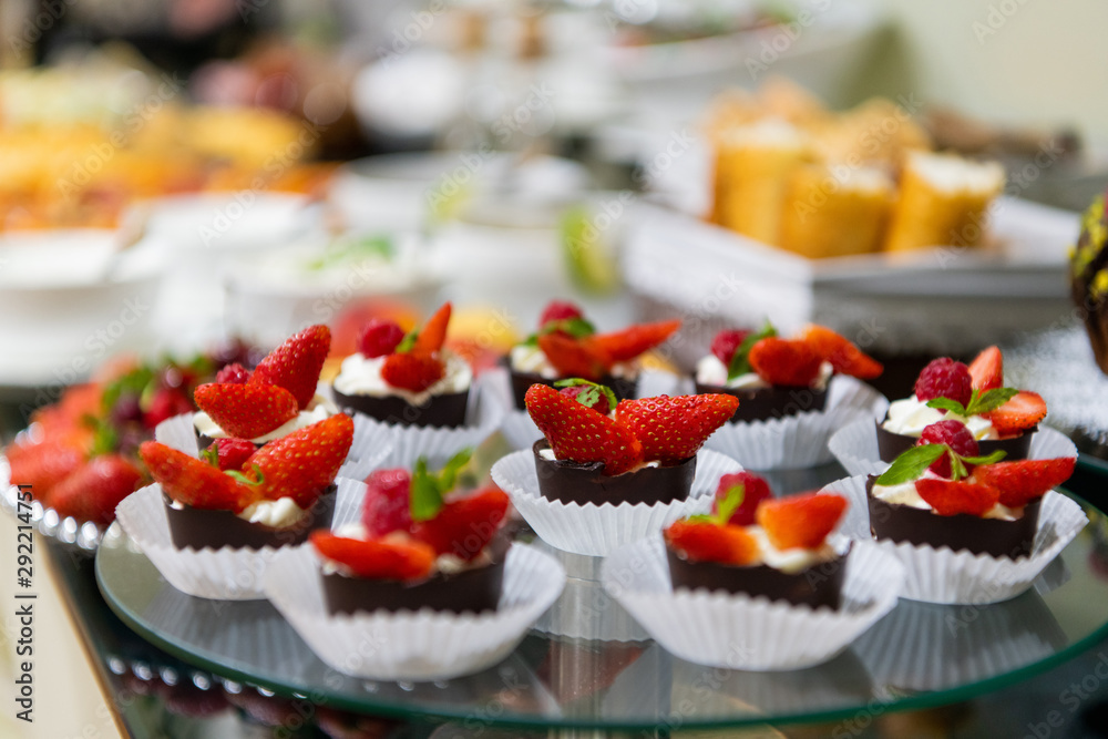 A tasty sweet dessert with creme and strawberries on a breakfast buffet at a hotel.