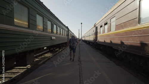 Wallpaper Mural Forward Slow: Tourist Walking on the Walk Way Found in the Middle of Two Trains - Erlian, Mongolia Torontodigital.ca