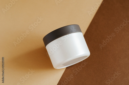 Wallpaper Mural Cosmetic cream, balm jar mockup on brown background. Makeup product blank container. Body care cosmetics, cleaning scrub in modern packaging. Facial skincare, moisturising mask for hair closeup image Torontodigital.ca