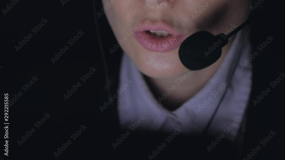 Close up - Woman customer service representative working at night. 4k. Remote working from home concept.