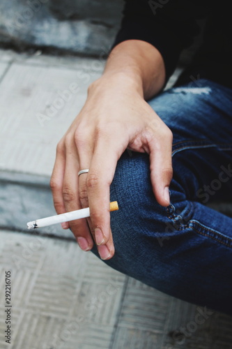 man with cigarette in hand