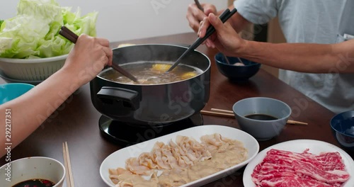 Family having hot pot together at home photo