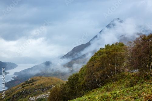 a high viewpoint over loch leven in the argyll region of scotland near kinlochleven and fort william on the west highland way showing loch waters and cloudy skies in autumn