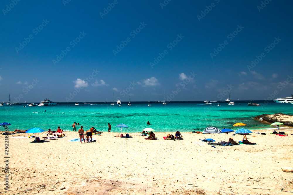 beach with umbrellas and sunbeds  from island formentera