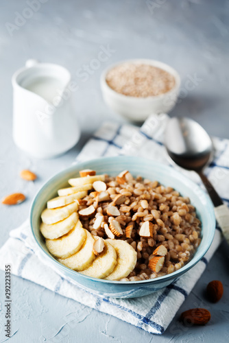 Barley porridge with banana slices and almonds