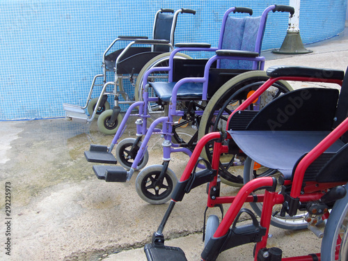 Wheelchairs on an accessible beach for transportation of people with disabilities in the water.