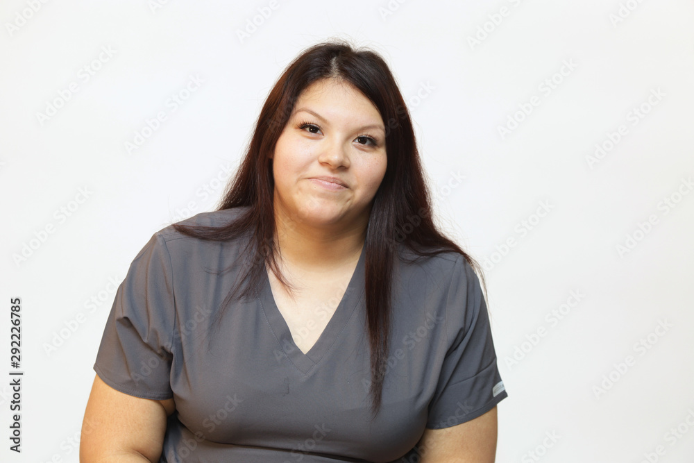 Portrait of a young female healthcare professional, a woman nurse on white background Portrait of a young female healthcare professional, a woman nurse on white background