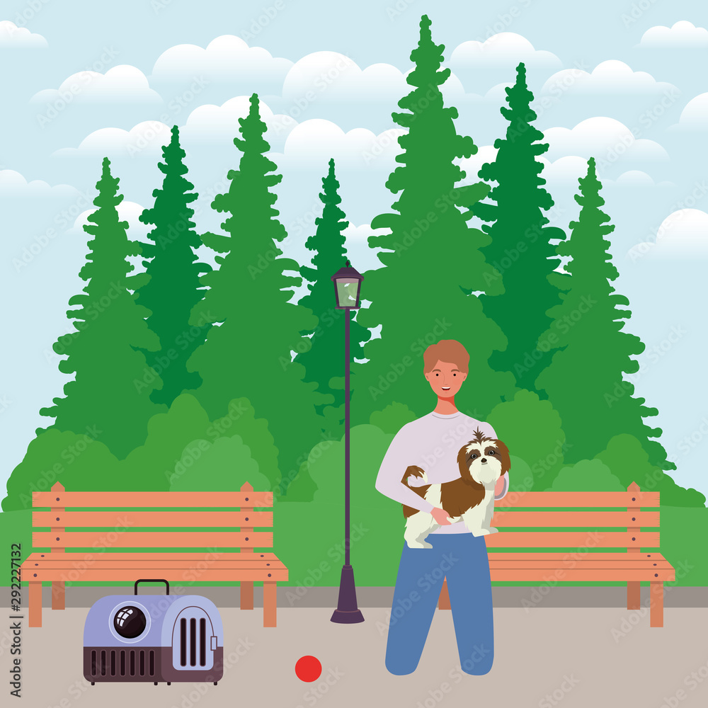 young man with cute dog mascot in the park young man with cute dog mascot in the park
