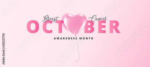 October text with pink heart balloon on soft pink background for Breast Cancer Awareness Month concept.