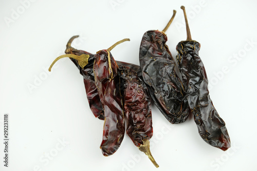 Chipotle Peppers (dried jalapeño, Capsicum annuum, Morita Variety), isolated on a white background photo