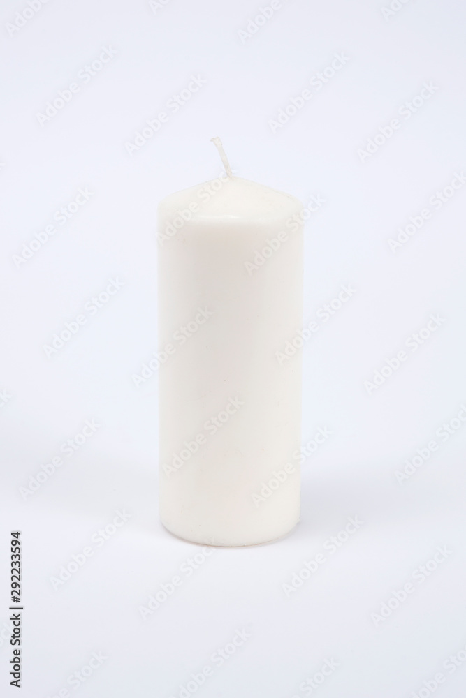 White candle on the white isolated background White candle on the white isolated background