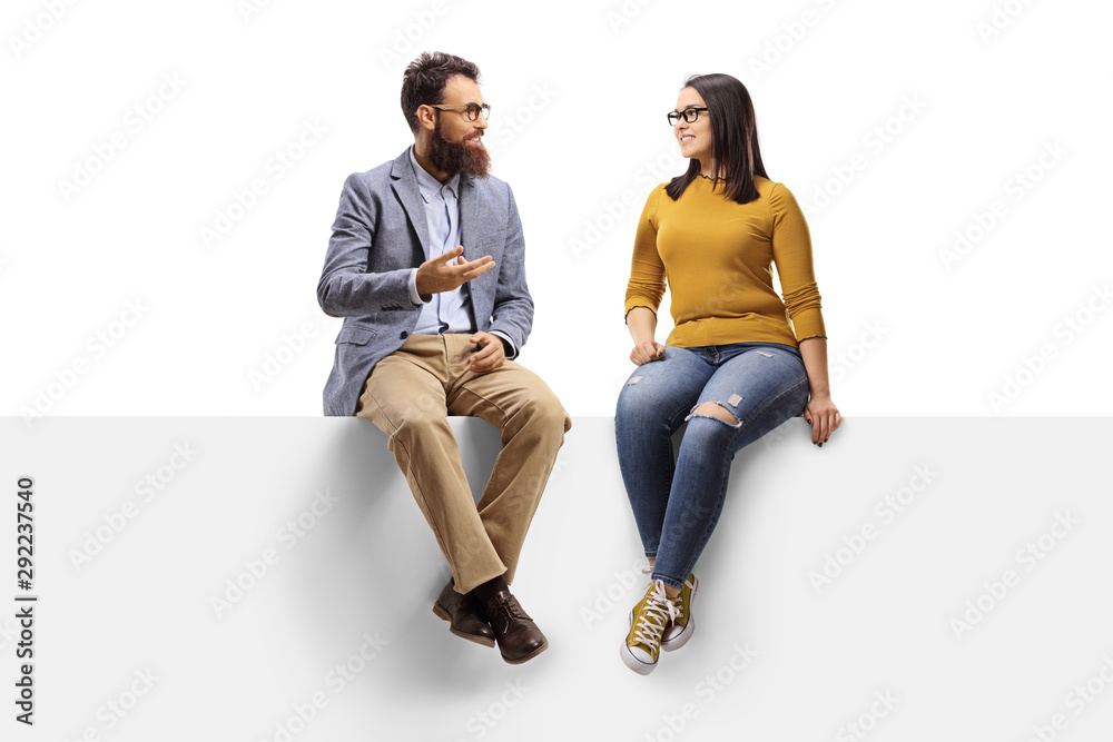 Bearded man talking to a young female seated on a banner - obrazy, fototapety, plakaty 