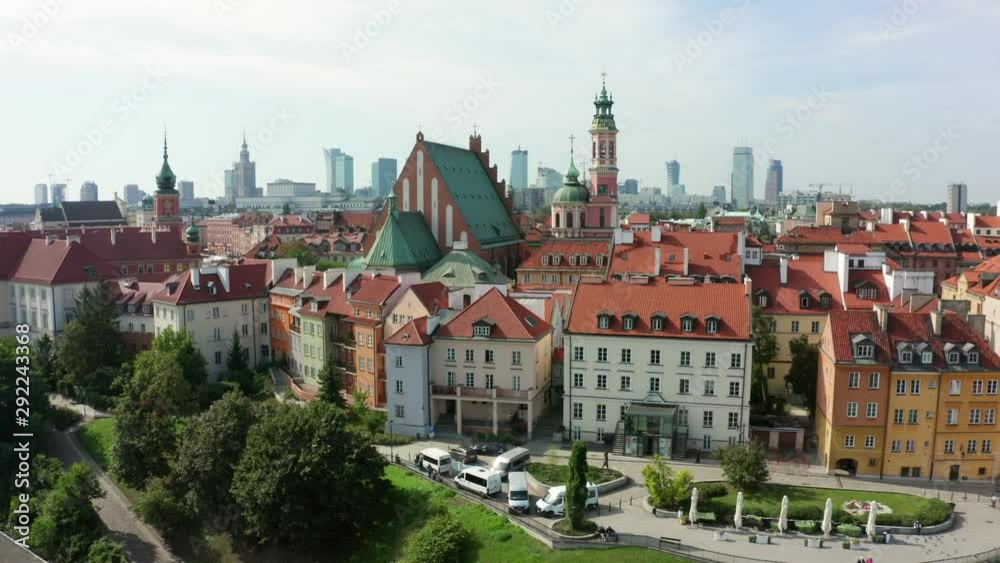 Aerial view of the old city and the royal palace in the historical center of Warsaw, Poland. Drone shot flying over city buildings in the Old Town. Aerial view of the old city and the royal palace in the historical center of Warsaw, Poland. Drone shot flying over city buildings in the Old Town.