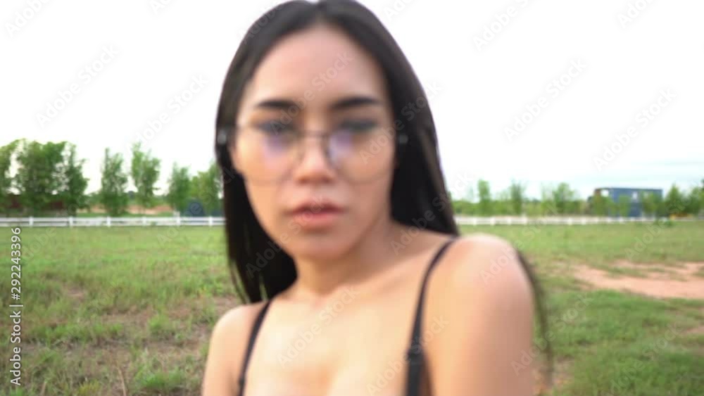 Portrait of sexy asian woman wear black bra on the field,Thailand people take a picture Portrait of sexy asian woman wear black bra on the field,Thailand people take a picture