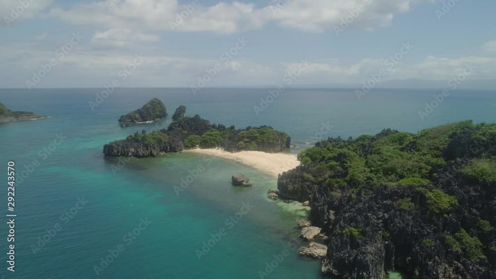 Aerial view islands with sand beach Lahus and turquoise water in blue lagoon among coral reefs, Caramoan Islands, Philippines. Landscape with sea, tropical beach. Aerial view islands with sand beach Lahus and turquoise water in blue lagoon among coral reefs, Caramoan Islands, Philippines. Landscape with sea, tropical beach.