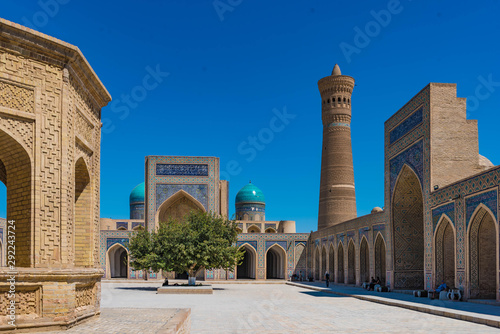 Inner Courtyard of the Kalyan mosque with minaret and iwan of the mir-i-arab madrasa in Bukhara Uzbekistan photo