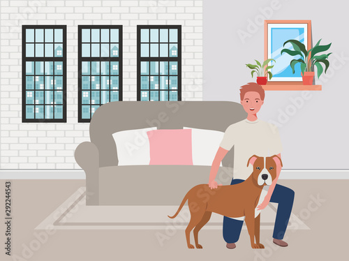 young man with cute dog mascot in the livingroom