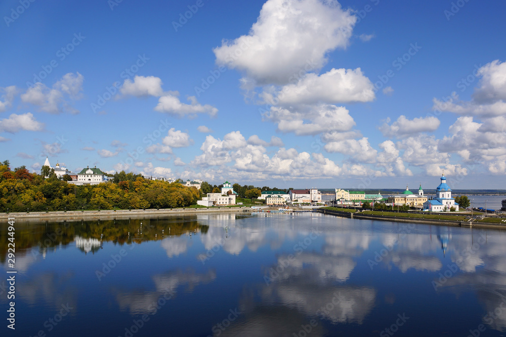 Cheboksary, Russia - September 10, 2019. View of the Cheboksary Bay and the Historical Embankment. On the right is the Church of the Assumption of the Mother of God