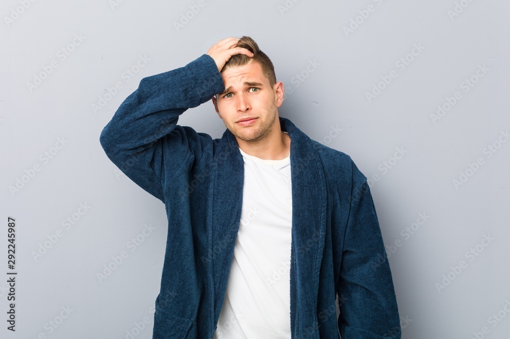 Young caucasian man wearing pajama being shocked, she has remembered important meeting. Young caucasian man wearing pajama being shocked, she has remembered important meeting.