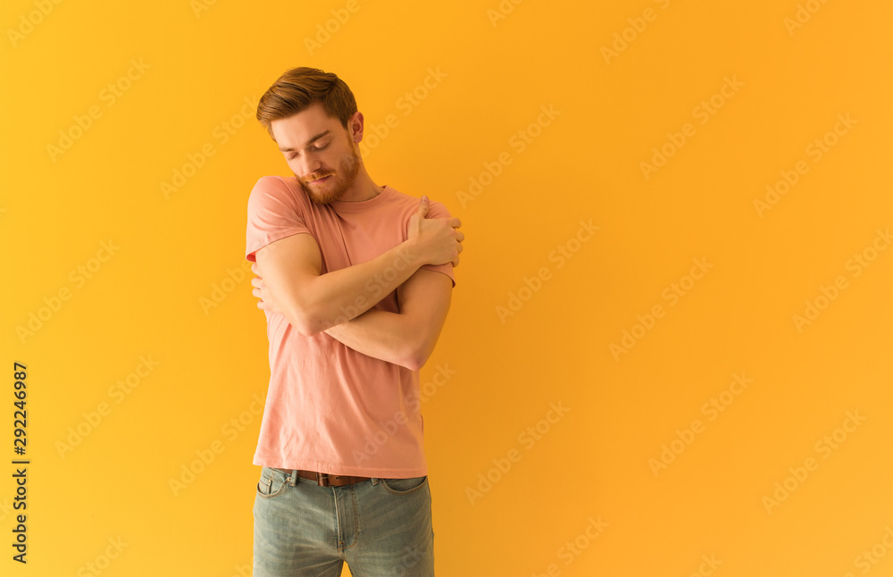 Young redhead man giving a hug Young redhead man giving a hug