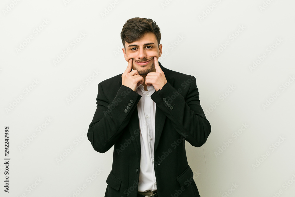 Young business hispanic man doubting between two options. Young business hispanic man doubting between two options.